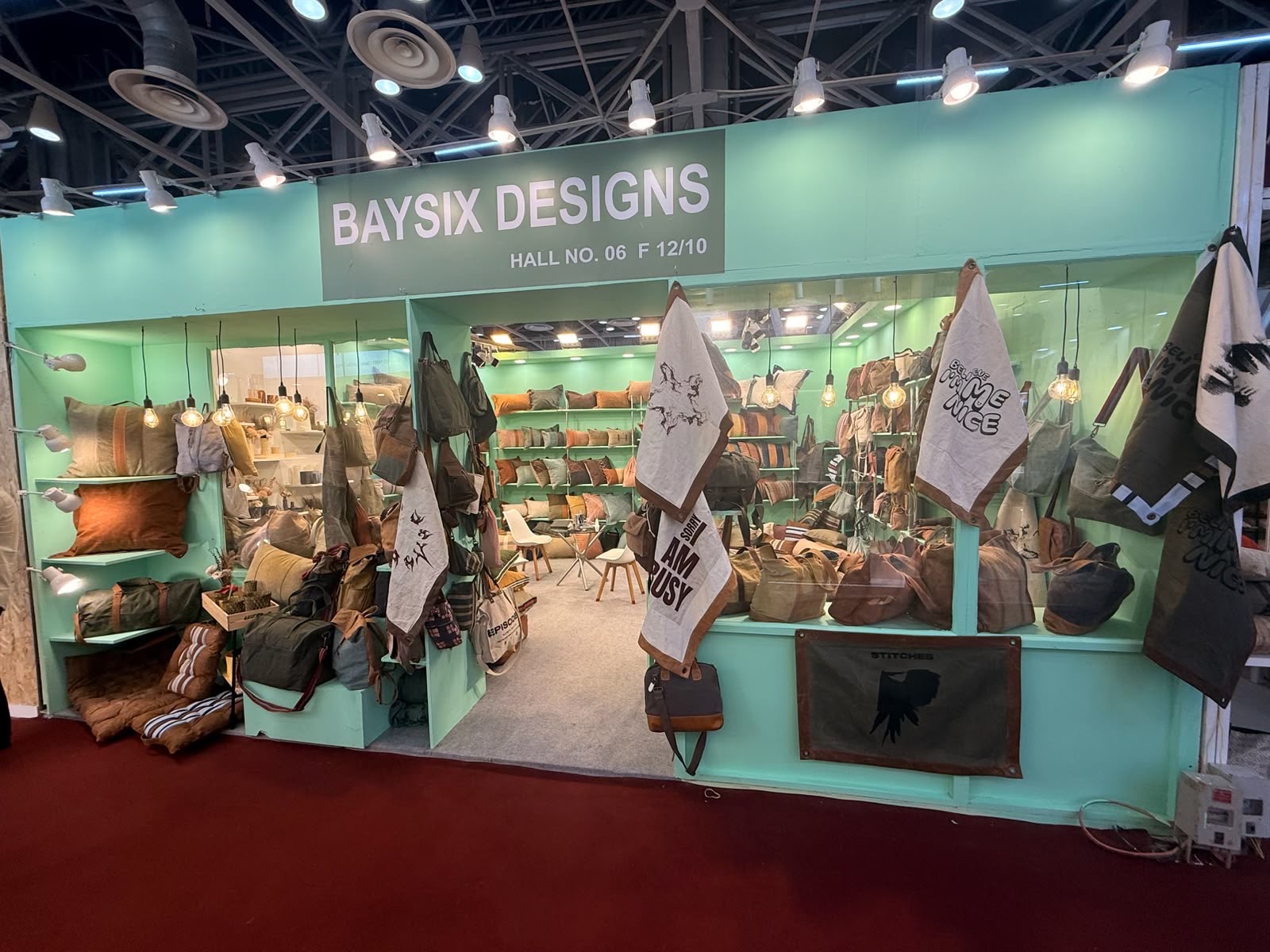 Baysix Designs trade fair booth with bags, cushions and printed textiles